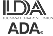 The image displays a logo with the text IDA prominently at the top, followed by Louisiana Dental Association, and below that, ADA. The logo features a stylized design with a combination of geometric shapes in shades of gray and white.
